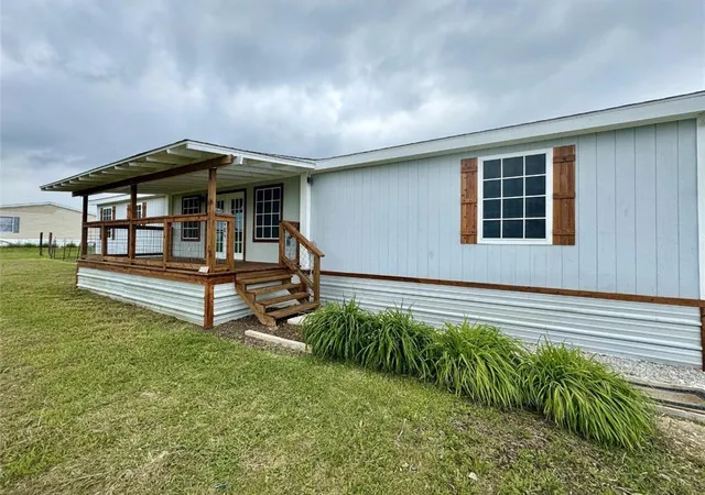 a house view with a garden space