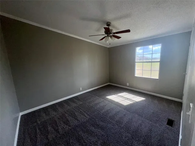 a view of empty room with windows