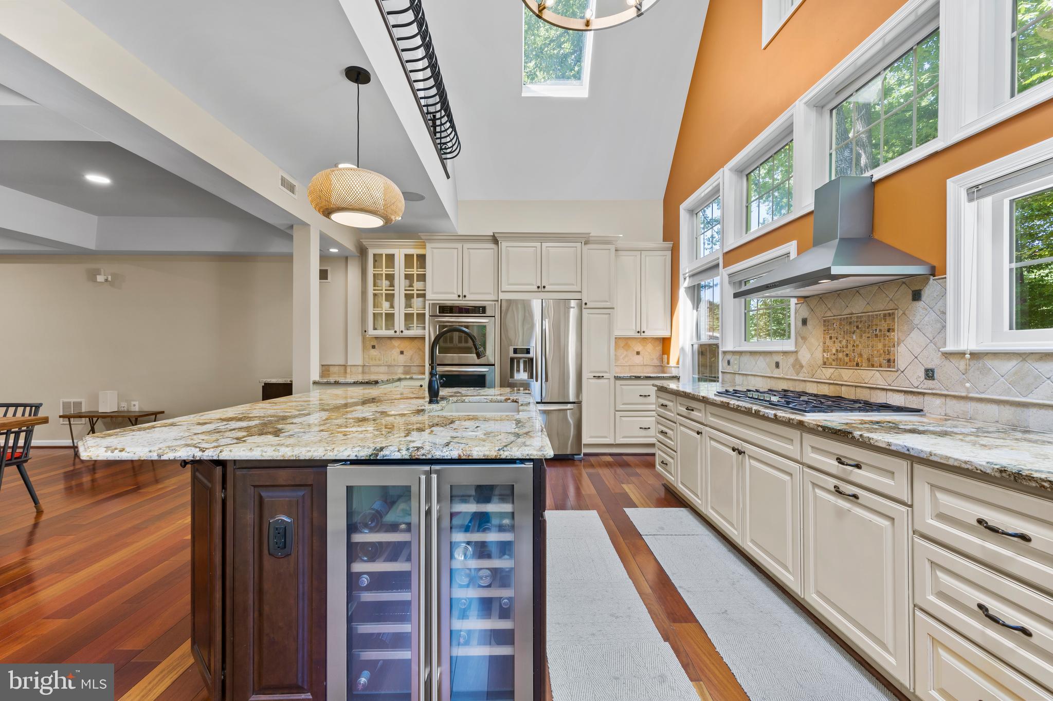 11019 Ring Road Reston, VA 20190 - Photo 19 of 78 a kitchen with stainless steel appliances granite countertop a stove and cabinets