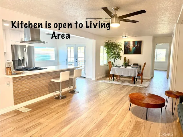 a view of a livingroom with furniture nad wooden floor