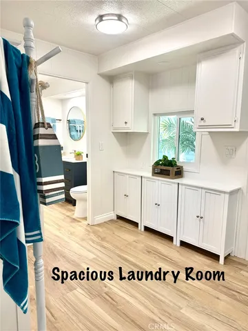 a view of kitchen with granite countertop window