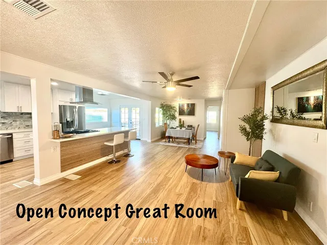 a living room with furniture and flat screen tv