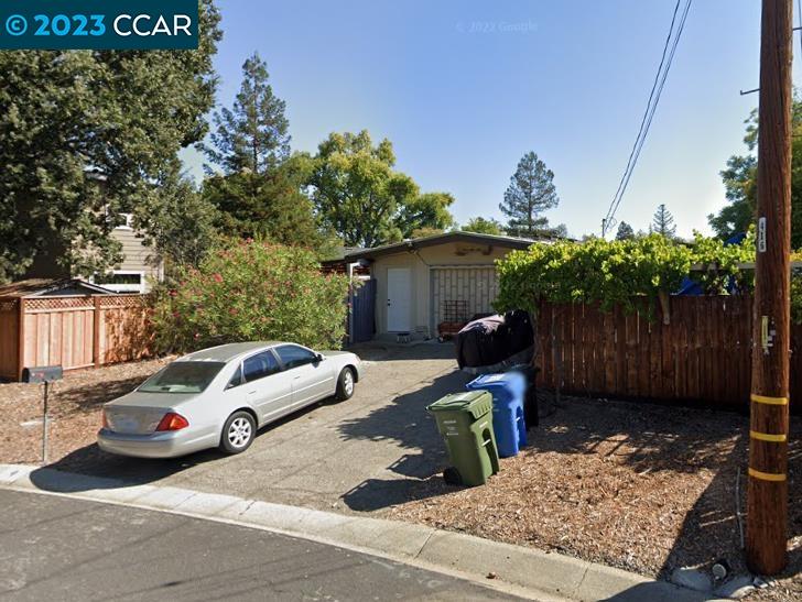 a car parked in front of a house