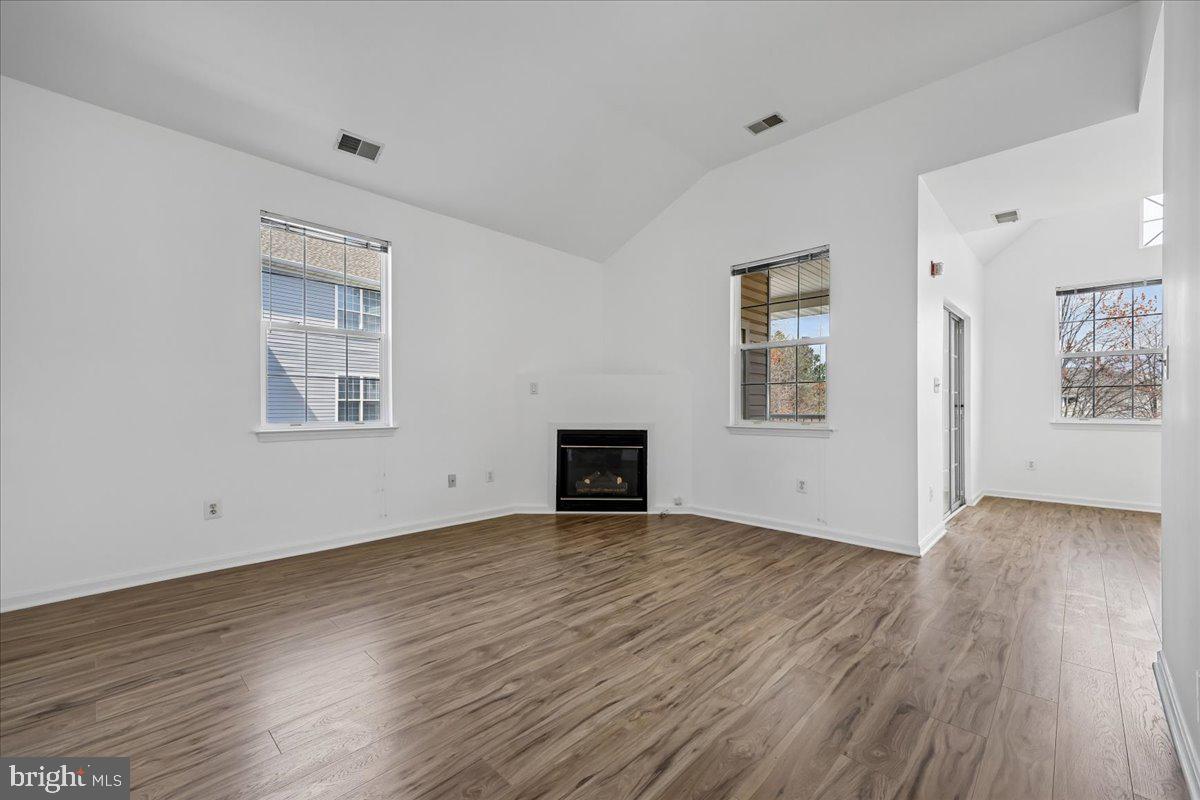 12700 Found Stone Road, Unit 206 Germantown, MD 20876 - Photo 6 of 38 Sunny Living Room with Fireplace & New Flooring
