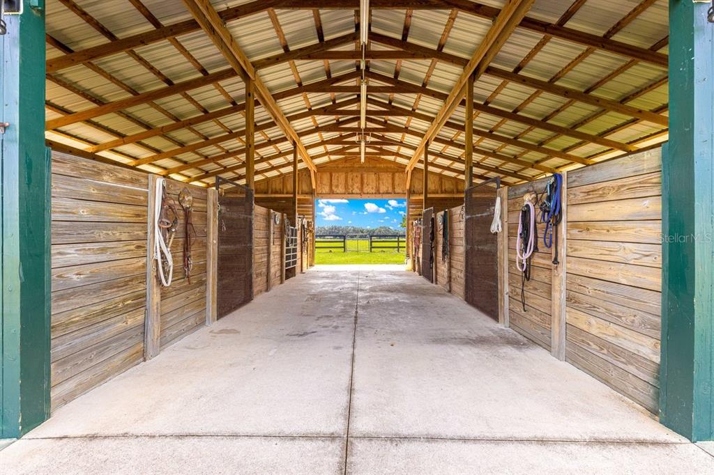 12345 Northeast 14th Avenue Anthony, FL 32617 - Photo 40 of 91 a view of a porch with a door and a refrigerator