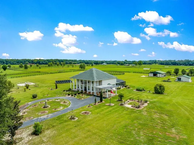 a view of a golf course with a big yard