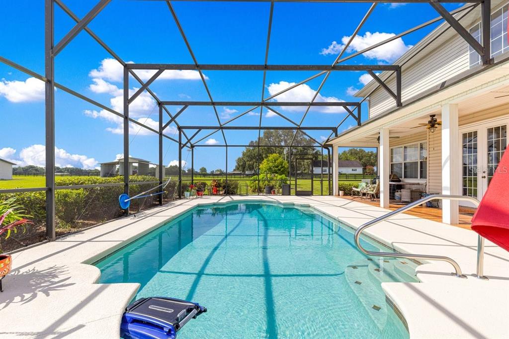 12345 Northeast 14th Avenue Anthony, FL 32617 - Photo 44 of 91 a view of a patio with a table and chairs under an umbrella