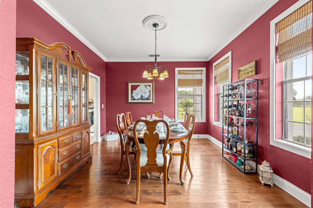 12345 Northeast 14th Avenue Anthony, FL 32617 - Photo 51 of 91 a view of a dining room with furniture window and wooden floor