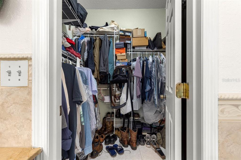 12345 Northeast 14th Avenue Anthony, FL 32617 - Photo 65 of 91 a view of walk in closet with clothes and shoes