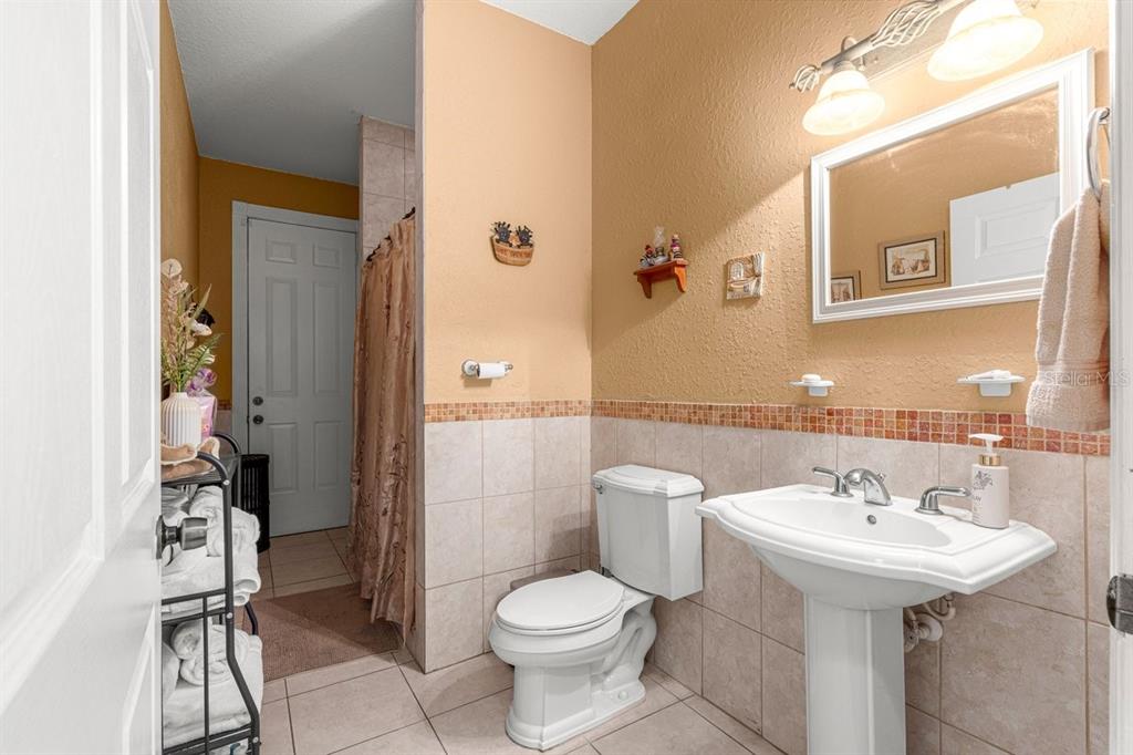 12345 Northeast 14th Avenue Anthony, FL 32617 - Photo 73 of 91 a bathroom with a sink toilet and shower