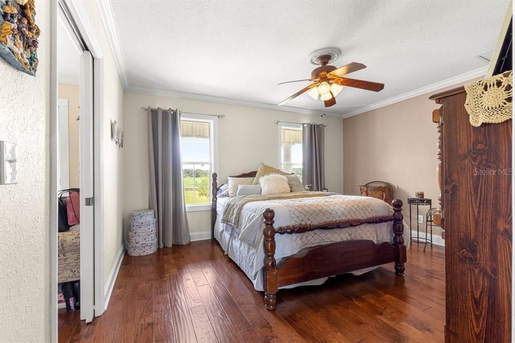 12345 Northeast 14th Avenue Anthony, FL 32617 - Photo 87 of 91 a bedroom with a bed and wooden floor