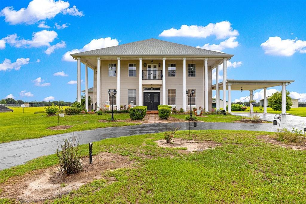 12345 Northeast 14th Avenue Anthony, FL 32617 - Photo 9 of 91 a view of a house with swimming pool and a yard