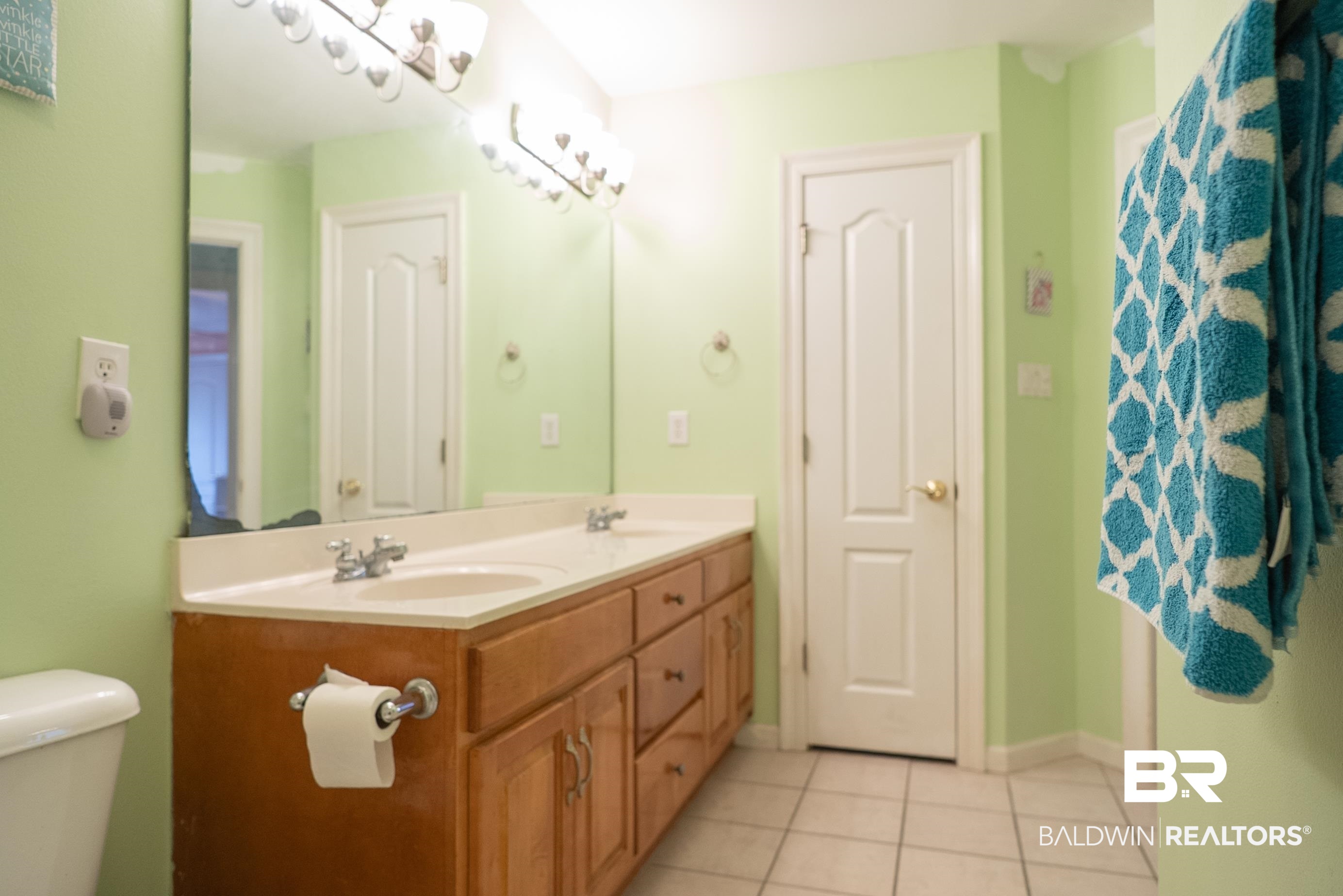 10023 Springfield Court Mobile, AL 36695 - Photo 30 of 50 Full bathroom featuring double vanity and light tile patterned flooring