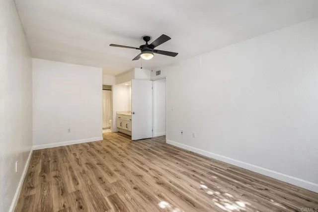 a view of a room with shelf on the wall