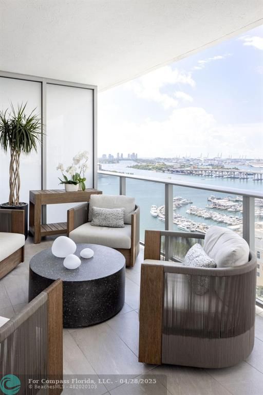 488 Northeast 18th Street, Unit 2010 Miami, FL 33132 - Photo 15 of 15 a living room with furniture and a potted plant