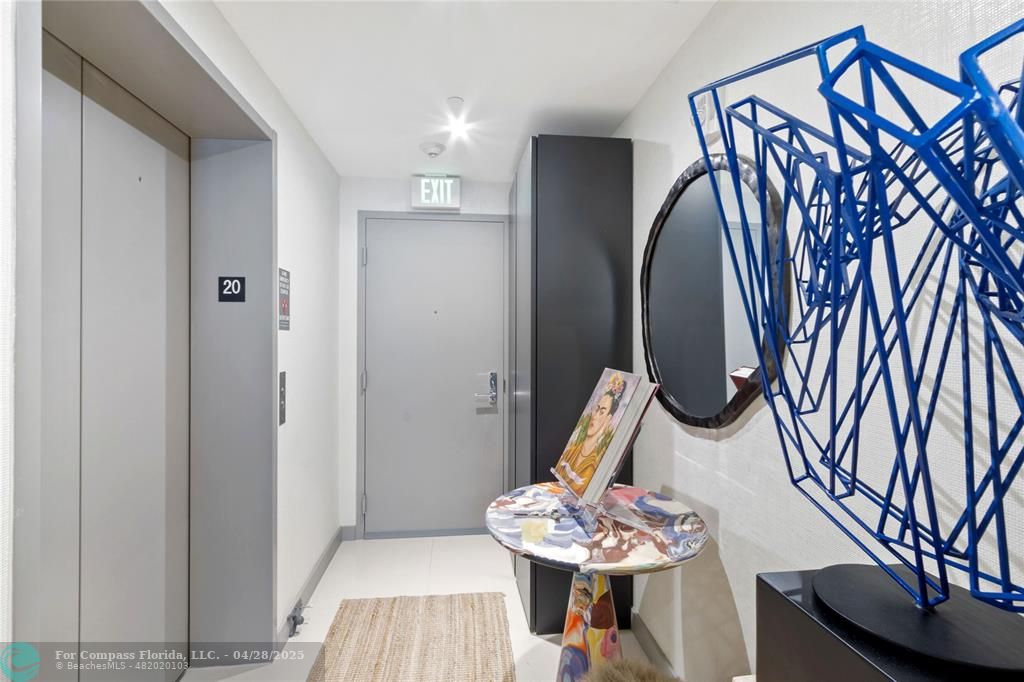 488 Northeast 18th Street, Unit 2010 Miami, FL 33132 - Photo 2 of 15 a view of a dining room with furniture and wooden floor
