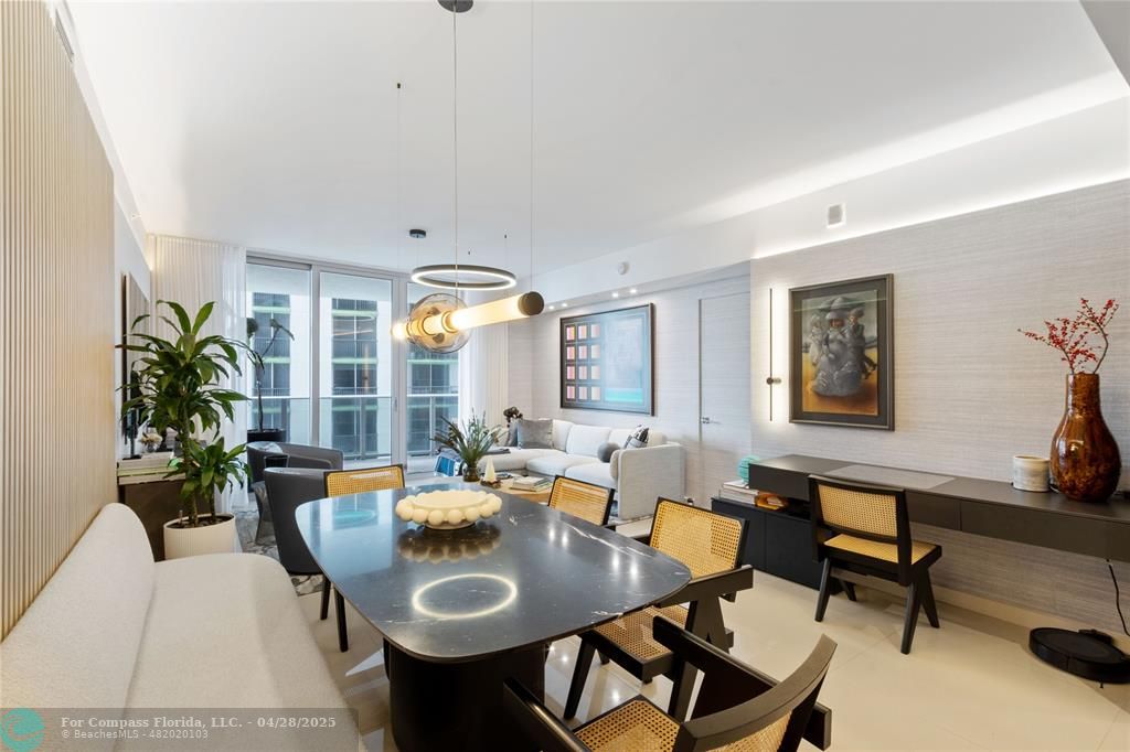 488 Northeast 18th Street, Unit 2010 Miami, FL 33132 - Photo 5 of 15 a living room with furniture and a potted plant