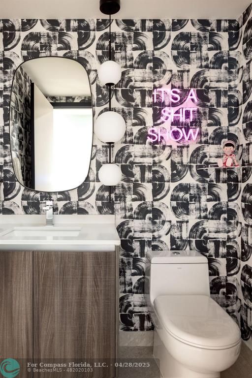 488 Northeast 18th Street, Unit 2010 Miami, FL 33132 - Photo 6 of 15 a bathroom with a sink mirror vanity and toilet