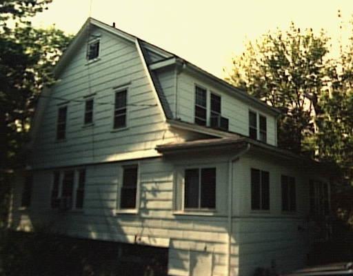 a front view of a house with yard