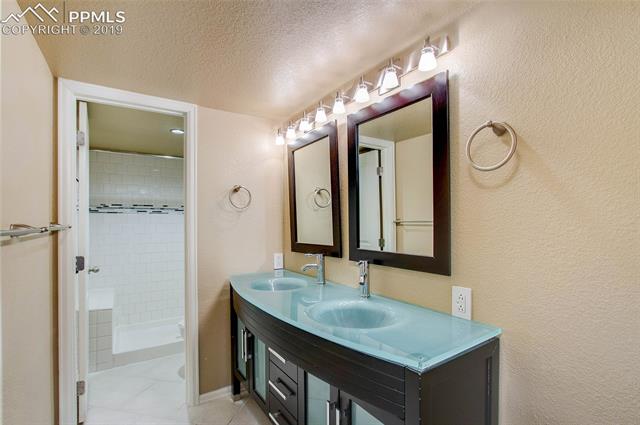 2384 Cinnabar Road Colorado Springs, CO 80921 - Photo 22 of 28 Remodeled basement bathroom.