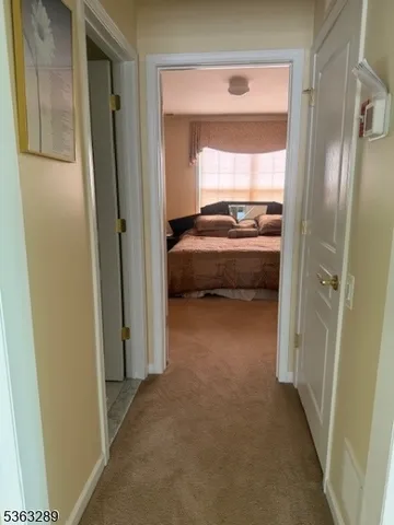 a bedroom with bed and a couch