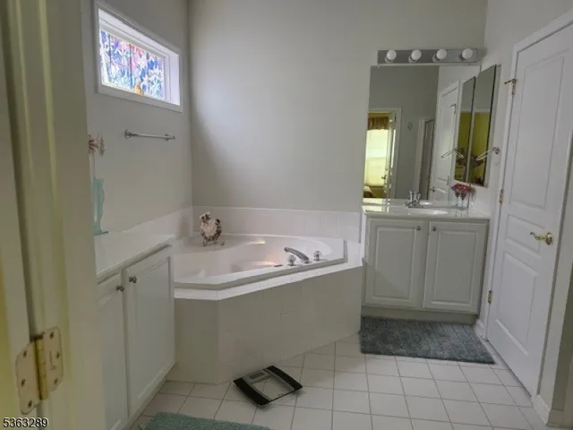 a bathroom with a shower and a sink