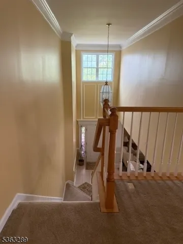 a living room with furniture a window and a chandelier