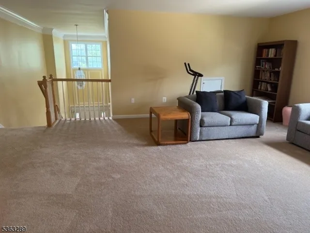 a balcony with table and chairs