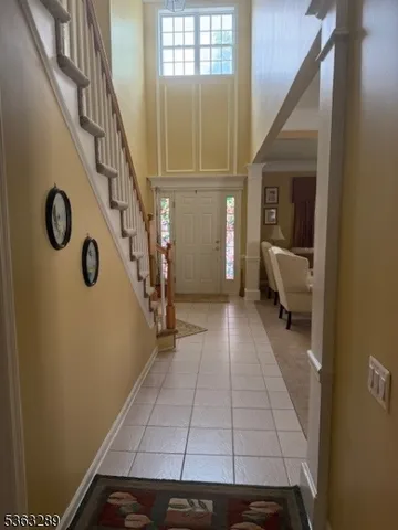 a kitchen with kitchen island granite countertop a sink dishwasher stove and cabinets