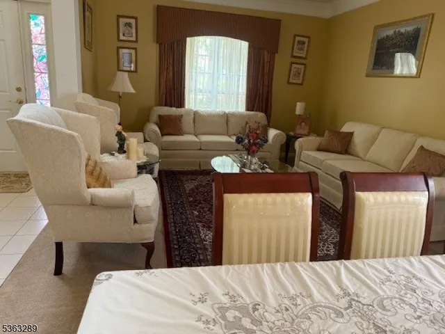 a view of a dining room with furniture and window