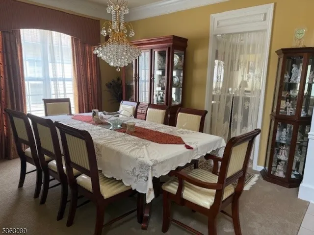 a view of a dining room with furniture and window