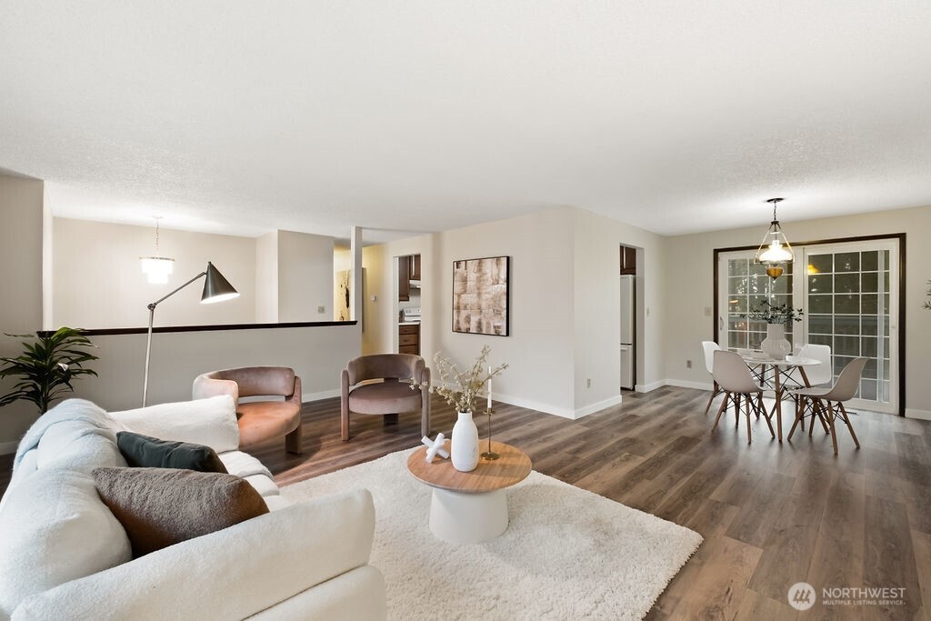 4813 208th Street East Spanaway, WA 98387 - Photo 11 of 39 a living room with furniture and a wooden floor