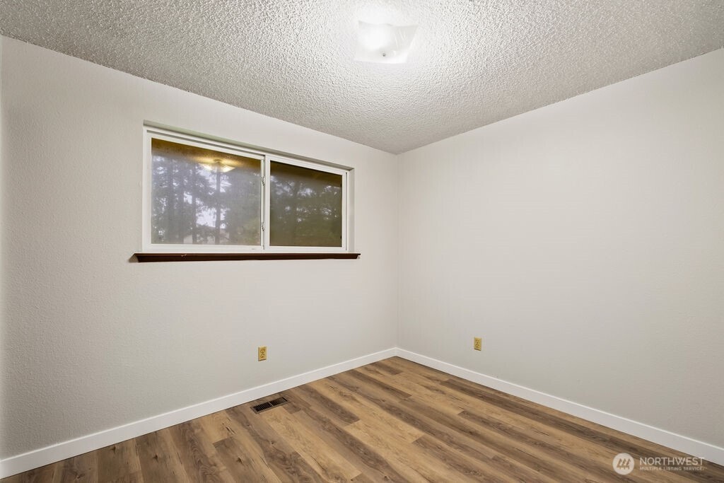 4813 208th Street East Spanaway, WA 98387 - Photo 22 of 39 a view of empty room with window
