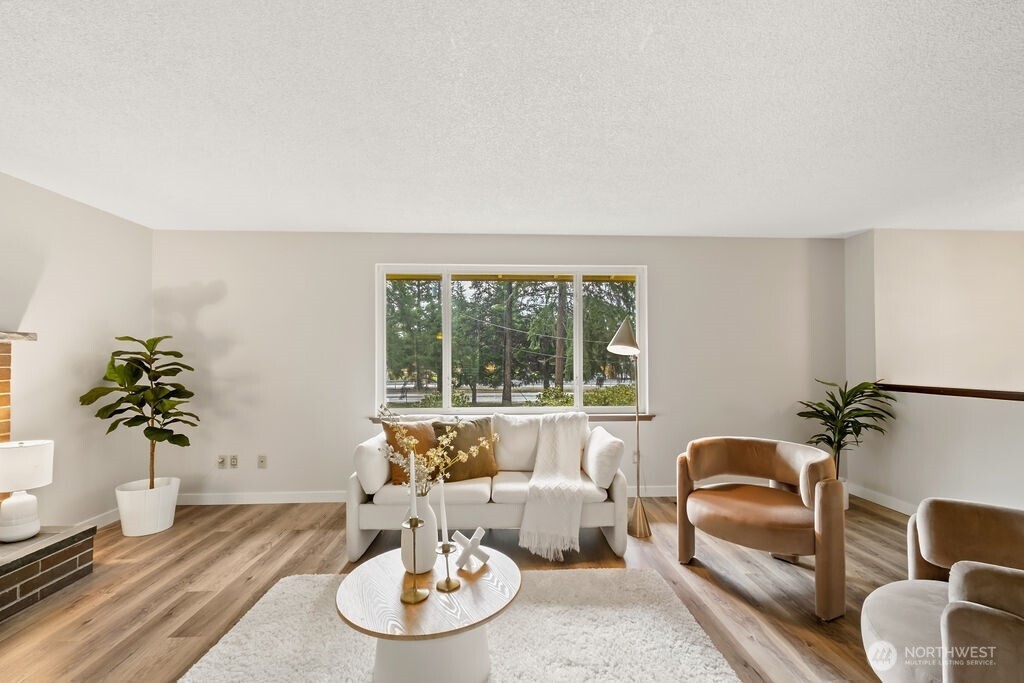 4813 208th Street East Spanaway, WA 98387 - Photo 6 of 39 a living room with furniture and a potted plant