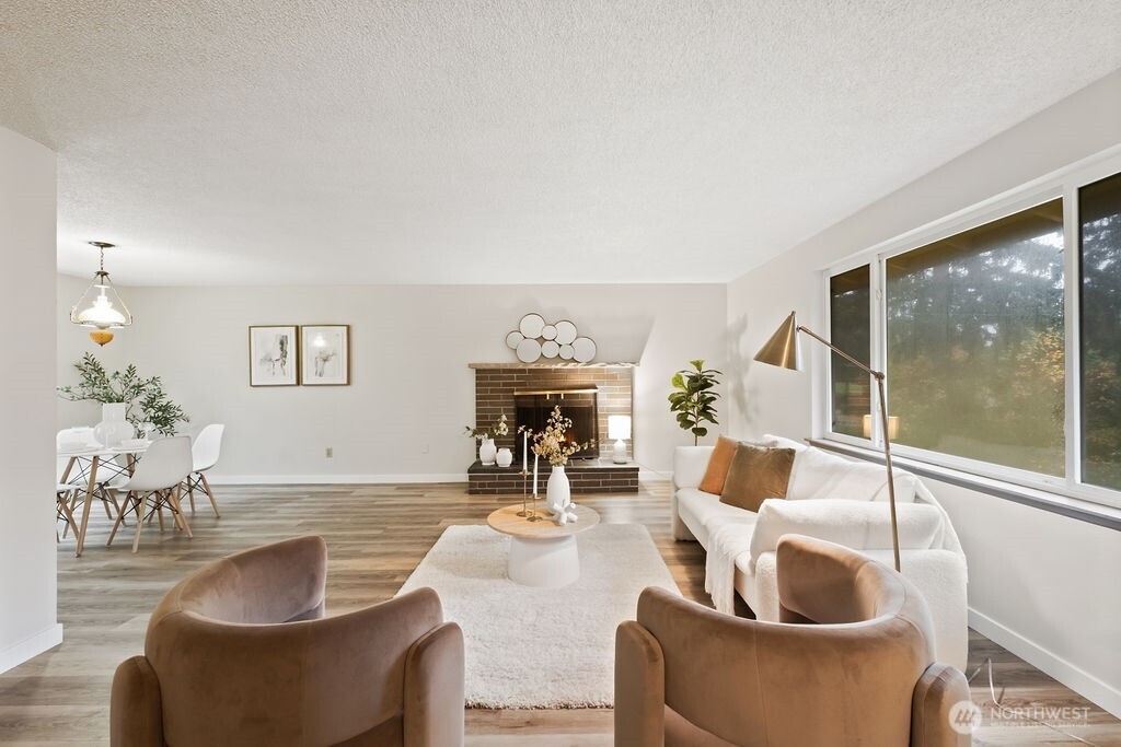 4813 208th Street East Spanaway, WA 98387 - Photo 7 of 39 a living room with furniture and a large window