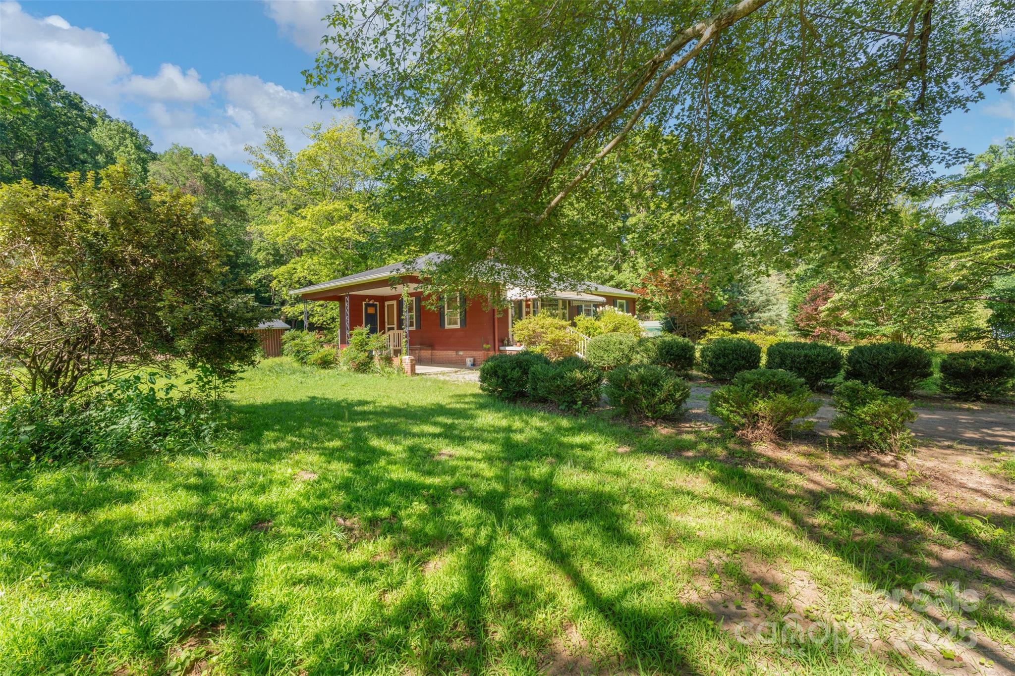 25 Wall Road Tryon, NC 28782 - Photo 2 of 21 a view of a house with a backyard