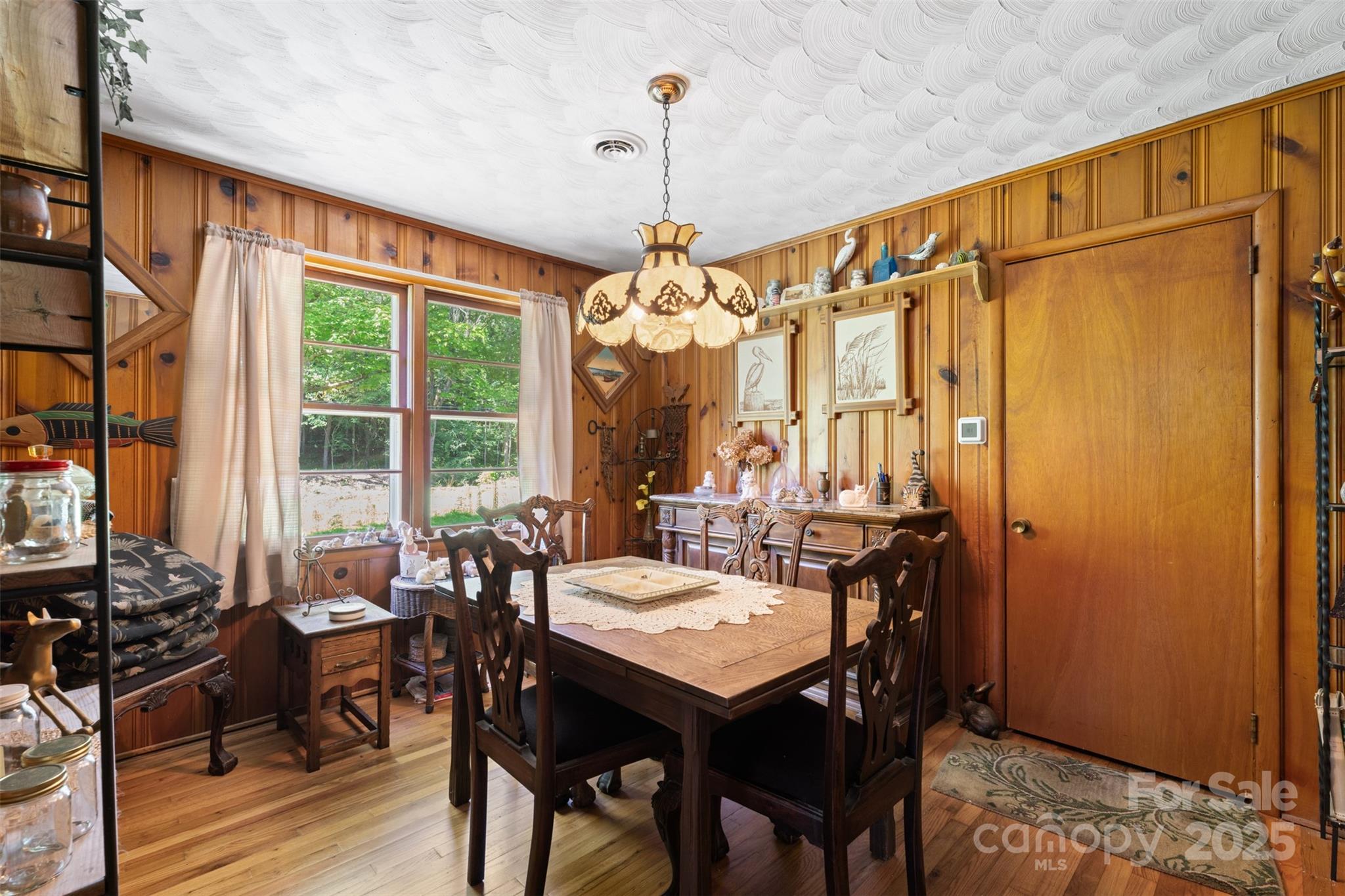 25 Wall Road Tryon, NC 28782 - Photo 10 of 21 a view of a dining room with furniture window and wooden floor