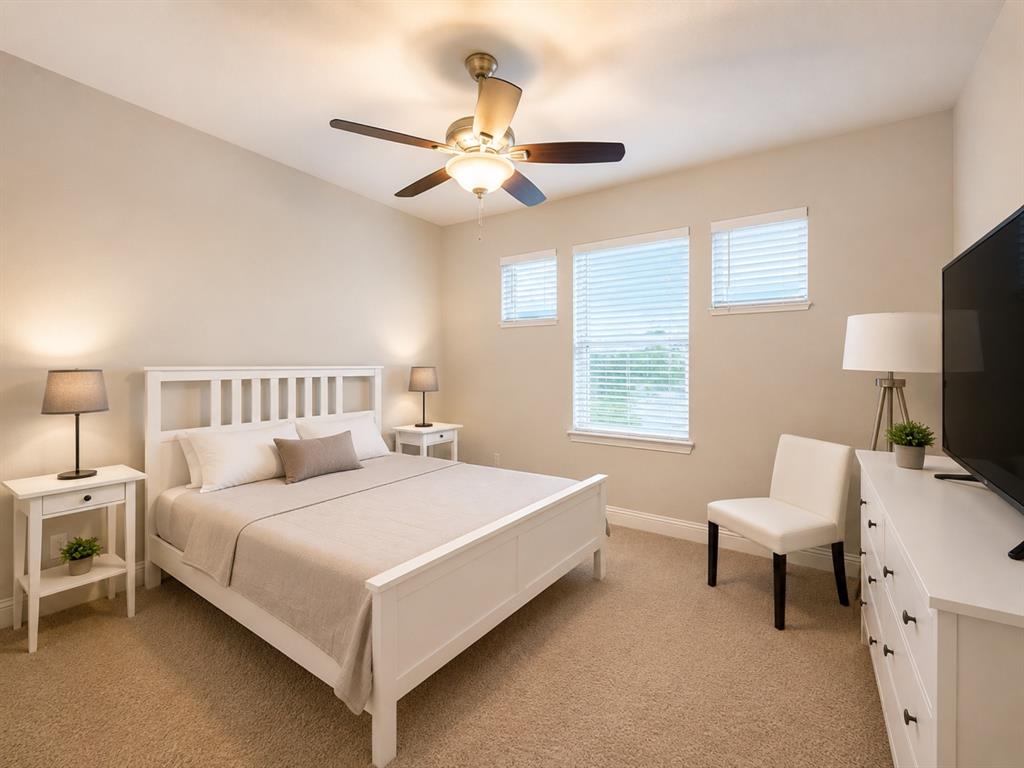 8235 Snapdragon Way Dallas, TX 75252 - Photo 18 of 29 Carpeted room featuring a ceiling fan with integrated lighting, multiple windows with blinds, a built-in dresser with dark hardware, and neutral-toned wall paint