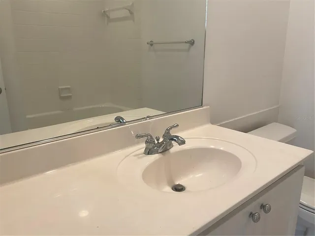 a bathroom with a sink and a vanity