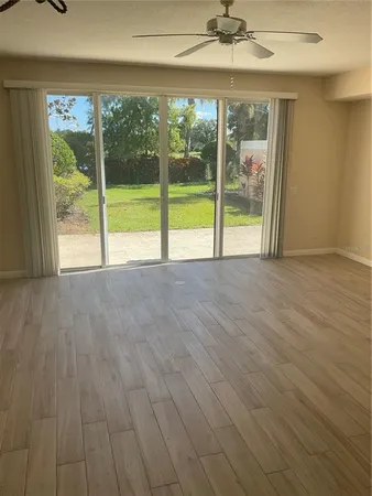 a view of an empty room with a window