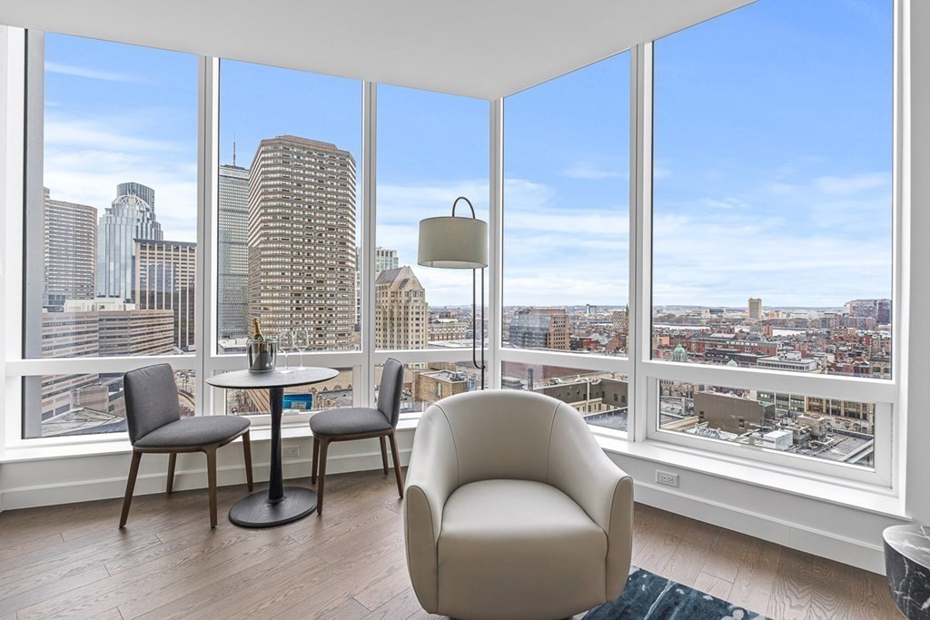 40 Trinity Place, Unit 1614 Boston, MA 02116 - Photo 13 of 26 a balcony with furniture and a large window