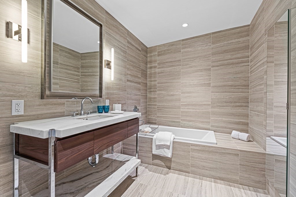 40 Trinity Place, Unit 1614 Boston, MA 02116 - Photo 18 of 26 a bathroom with a sink and a mirror