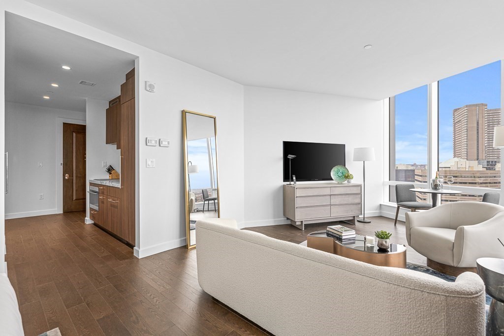 40 Trinity Place, Unit 1614 Boston, MA 02116 - Photo 4 of 26 a living room with furniture and a flat screen tv