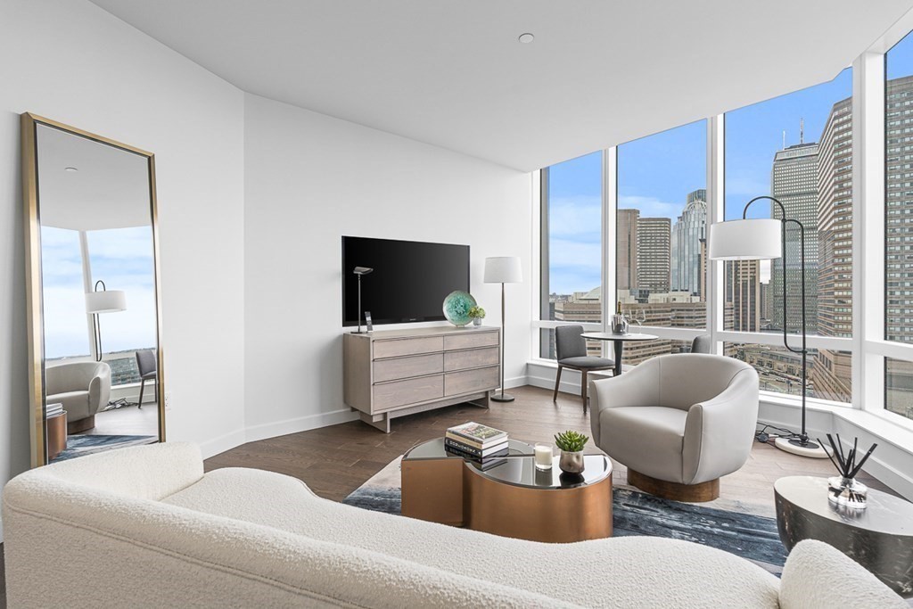 40 Trinity Place, Unit 1614 Boston, MA 02116 - Photo 6 of 26 a living room with furniture and a flat screen tv