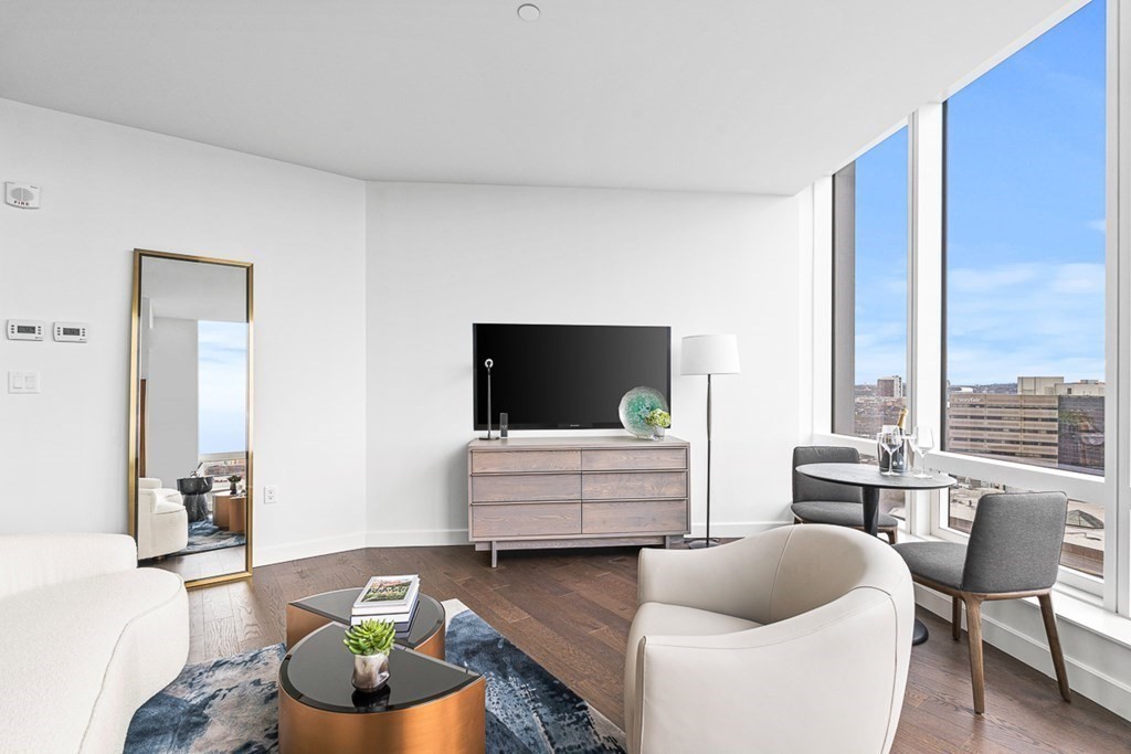 40 Trinity Place, Unit 1614 Boston, MA 02116 - Photo 7 of 26 a living room with furniture and a flat screen tv