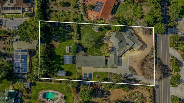 an aerial view of a house with a garden space