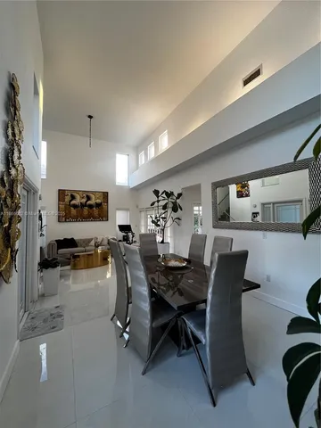 a view of a livingroom with furniture and a potted plant