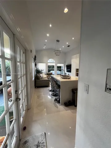 a view of living room with furniture and a flat screen tv