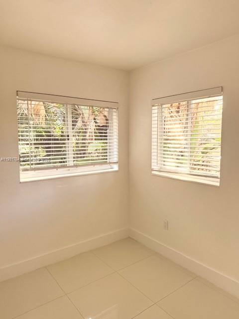 1030 Northeast 80th Street, Unit 1 Miami, FL 33138 - Photo 16 of 22 a view of an empty room with a window