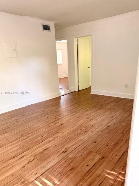 1030 Northeast 80th Street, Unit 1 Miami, FL 33138 - Photo 2 of 22 wooden floor in an empty room